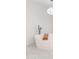 Elegant free-standing bathtub with modern fixtures and unique design under decorative light fixture at 3102 E Mariposa St, Phoenix, AZ 85016
