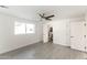 Spacious bedroom with a ceiling fan, attached bathroom and walk-in closet at 3102 E Mariposa St, Phoenix, AZ 85016