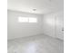 Bright bedroom with large window and neutral colors providing a serene space to relax at 3102 E Mariposa St, Phoenix, AZ 85016