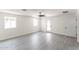 Spacious bedroom with light wood flooring, modern ceiling fan, and natural light at 3102 E Mariposa St, Phoenix, AZ 85016