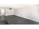 Bonus room with modern light fixture and tile flooring offers flexible space at 3102 E Mariposa St, Phoenix, AZ 85016