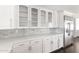 White cabinets, quartz countertops, and subway tile in a bright kitchen at 3102 E Mariposa St, Phoenix, AZ 85016