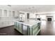 Gourmet kitchen boasts custom island, stainless appliances, and tile backsplash at 3102 E Mariposa St, Phoenix, AZ 85016