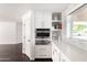 Modern kitchen features white cabinetry, stainless appliances, and built in microwave at 3102 E Mariposa St, Phoenix, AZ 85016