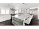 Modern kitchen featuring a large island, stainless hood, and natural light at 3102 E Mariposa St, Phoenix, AZ 85016