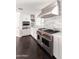 Modern kitchen boasts a professional range, stainless hood, and marble backsplash at 3102 E Mariposa St, Phoenix, AZ 85016