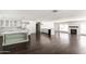 Spacious living room showcasing hardwood floors, a kitchen island, and fireplace at 3102 E Mariposa St, Phoenix, AZ 85016