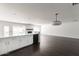 Open-concept living space with hardwood floors, fireplace, bar, and backyard access at 3102 E Mariposa St, Phoenix, AZ 85016