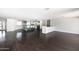 Open-concept living space with hardwood floors and kitchen featuring a breakfast bar at 3102 E Mariposa St, Phoenix, AZ 85016