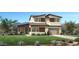 Stunning two-story home boasts a modern design, lush lawn, and a convenient two-car garage at 3362 W Sunstone Dr, San Tan Valley, AZ 85144