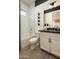 Bright bathroom with a shower-tub combo, white tiling, and modern fixtures at 3390 W Sunstone Dr, San Tan Valley, AZ 85144