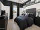 Cozy bedroom with modern decor, a plush bed, and dark accents at 3390 W Sunstone Dr, San Tan Valley, AZ 85144
