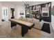 Recreation area featuring a shuffleboard table, modern furnishings, and a statement guitar-themed wallpaper at 3390 W Sunstone Dr, San Tan Valley, AZ 85144