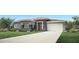 Modern single-story home featuring a two-car garage, manicured lawn and elegant landscaping at 3419 W Sunstone Dr, San Tan Valley, AZ 85144