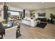 Open-concept living room with sliding glass doors to outdoor space at 3419 W Sunstone Dr, San Tan Valley, AZ 85144