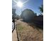 This backyard shows a grassy area with an irrigation system and lots of sunshine at 344 E Aepli Dr, Tempe, AZ 85282