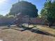 A large, grassy backyard features a playset with swings and slide at 344 E Aepli Dr, Tempe, AZ 85282