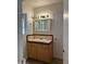 Bathroom with tiled countertop, white sink and a medicine cabinet with a mirror at 344 E Aepli Dr, Tempe, AZ 85282