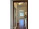 Hallway view of the primary bathroom featuring a walk-in shower and a granite topped vanity with dual sinks at 344 E Aepli Dr, Tempe, AZ 85282