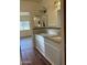 The bathroom boasts a granite countertop with dual sinks, framed mirrors, and decorative lighting at 344 E Aepli Dr, Tempe, AZ 85282