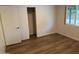 Bedroom with laminate flooring, closet and window offering view to outdoors at 344 E Aepli Dr, Tempe, AZ 85282