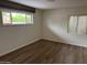 Bedroom featuring laminate flooring and windows offering view to outdoors at 344 E Aepli Dr, Tempe, AZ 85282