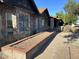A detailed view of the house's unique stone exterior and well-maintained landscaping at 344 E Aepli Dr, Tempe, AZ 85282