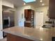 Kitchen featuring stainless steel appliances, granite countertops and wood cabinets at 344 E Aepli Dr, Tempe, AZ 85282