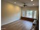 Living room featuring laminate flooring, ceiling fan and window offering view to outdoors at 344 E Aepli Dr, Tempe, AZ 85282