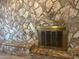 A stone fireplace with metal doors complements this cozy living space at 344 E Aepli Dr, Tempe, AZ 85282