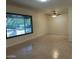 Spacious living room with light tile floors and an overhead fan at 344 E Aepli Dr, Tempe, AZ 85282