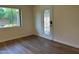 Well lit living room with nice wood floors and an art-deco-style door at 344 E Aepli Dr, Tempe, AZ 85282