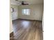 Open living room featuring laminate flooring and a door leading to outdoors at 344 E Aepli Dr, Tempe, AZ 85282
