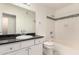 Bright bathroom with a tiled shower/tub, white cabinets, and granite countertop at 3633 N 3Rd Ave # 2031, Phoenix, AZ 85013
