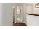 Hallway view of the bathroom featuring a glass shower, tile floors, and stainless steel appliances at 3633 N 3Rd Ave # 2031, Phoenix, AZ 85013