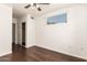 Bedroom with hardwood floors, a ceiling fan, a window, and closet with sliding doors at 3633 N 3Rd Ave # 2031, Phoenix, AZ 85013