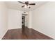 Bedroom featuring wood floors, ceiling fan, and a laundry closet at 3633 N 3Rd Ave # 2031, Phoenix, AZ 85013
