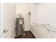 Storage closet features wood floors, a water heater, and shelving at 3633 N 3Rd Ave # 2031, Phoenix, AZ 85013