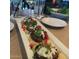 Close-up shot of an array of food including hors d'oeuvres, salads and beverages at 3633 N 3Rd Ave # 2031, Phoenix, AZ 85013