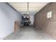 Spacious garage featuring ample storage space and a brick wall at 3633 N 3Rd Ave # 2031, Phoenix, AZ 85013