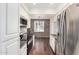 Galley kitchen featuring stainless appliances, white cabinets, and dark countertops at 3633 N 3Rd Ave # 2031, Phoenix, AZ 85013