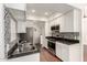 Bright kitchen featuring white cabinetry, stainless steel appliances, granite countertops, and mosaic backsplash at 3633 N 3Rd Ave # 2031, Phoenix, AZ 85013