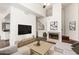 Bright living room with fireplace, flat screen tv, and modern furnishings in neutral color palette at 3633 N 3Rd Ave # 2031, Phoenix, AZ 85013