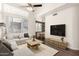 Open-concept living room features hardwood floors, high ceilings, and natural light at 3633 N 3Rd Ave # 2031, Phoenix, AZ 85013