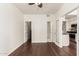 Living room featuring wood floors with a kitchen view and closet at 3633 N 3Rd Ave # 2031, Phoenix, AZ 85013