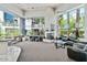 Bright and spacious lounge area with modern furniture, fireplace, and large windows at 3633 N 3Rd Ave # 2031, Phoenix, AZ 85013