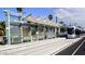 Clean and efficient light rail station with shade structures and palm trees enhancing the transit experience at 3633 N 3Rd Ave # 2031, Phoenix, AZ 85013
