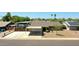 Aerial view showcasing the property's layout with RV parking, desert landscape, and neighborhood at 3802 W Kelton Ln, Phoenix, AZ 85053
