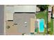 Aerial view of the property showcasing the pool, covered patio, well-maintained roof, and surrounding neighborhood at 3802 W Kelton Ln, Phoenix, AZ 85053