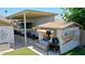 Driveway and parking area under a covered carport, featuring a shed at 3802 W Kelton Ln, Phoenix, AZ 85053